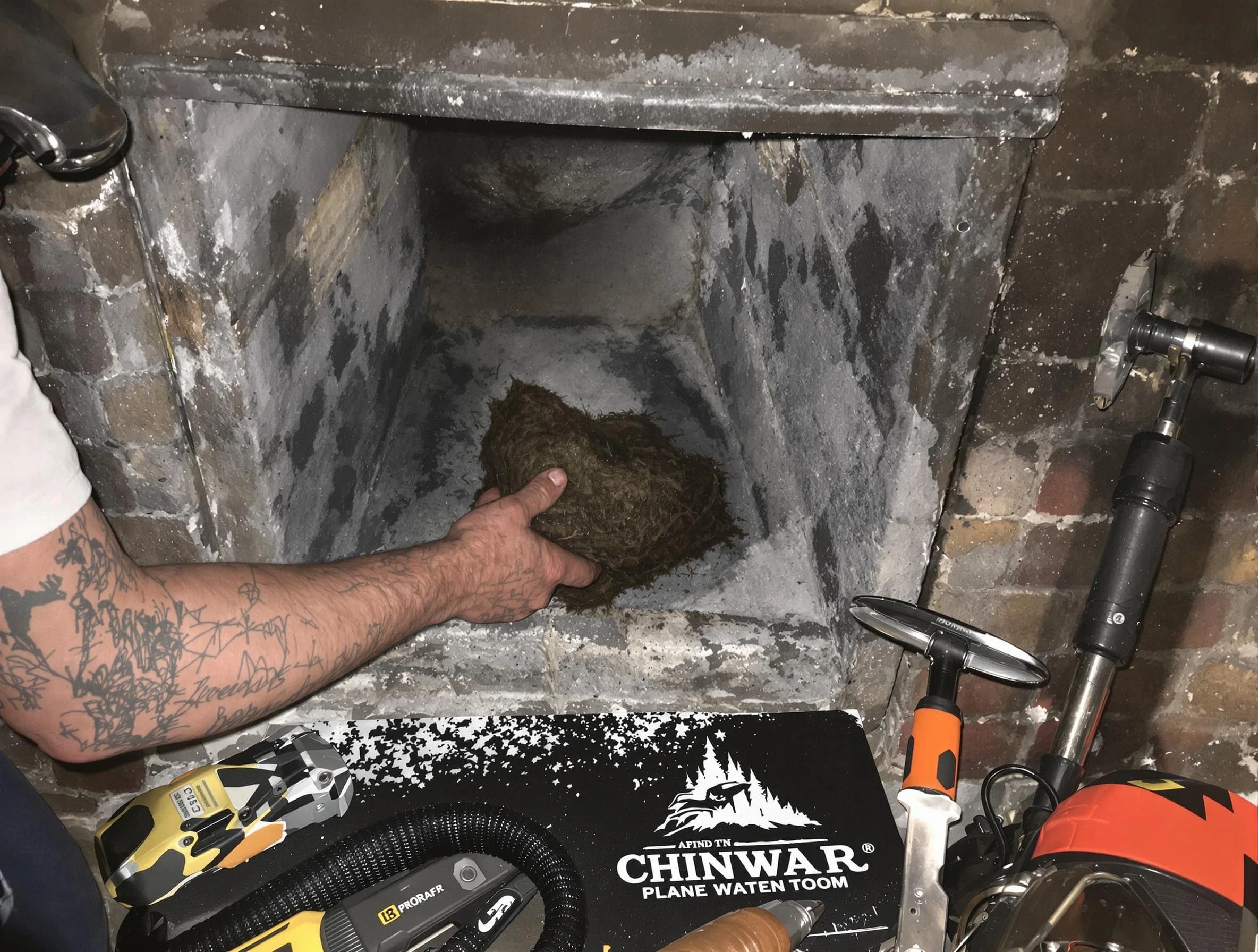 Mountain Brook Chimney Sweep safely removing debris and screening chimney in Mountain Brook, AL